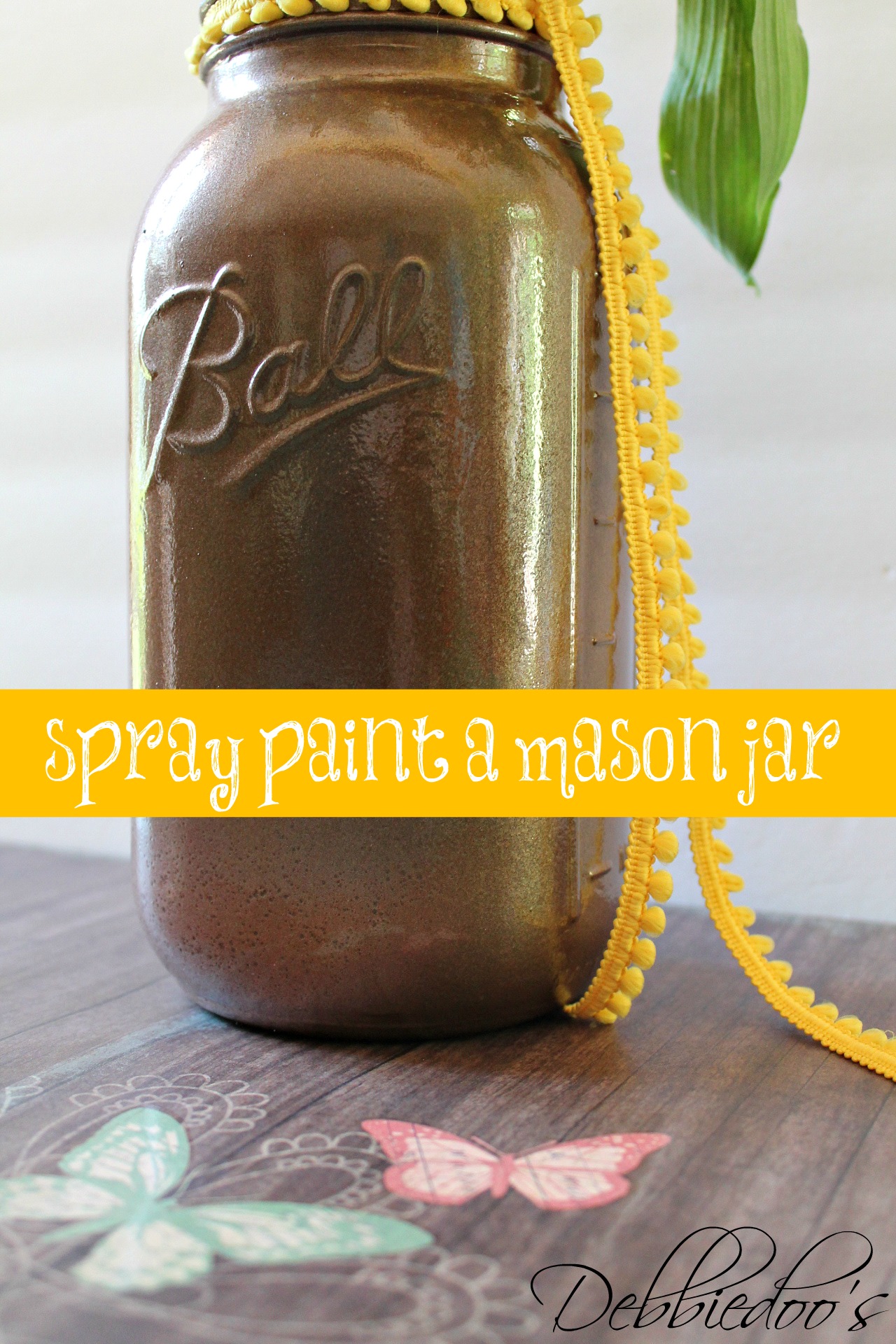 Spray painting a mason jar with Rust oleum spray paint Debbiedoos